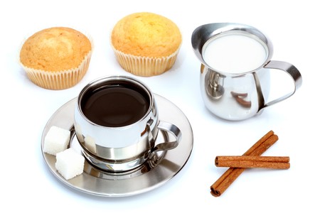 Cup of black coffee with muffin, milk and cinnamon 1の写真素材