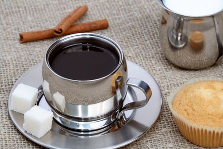 Cup of black coffee with muffin, milk and cinnamon, coffee seriesの写真素材
