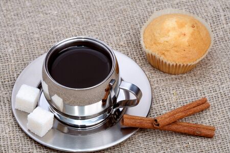 Cup of black coffee with muffin and cinnamon, coffee seriesの写真素材