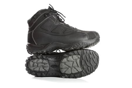 Two black winter boots , isolated on whiteの写真素材