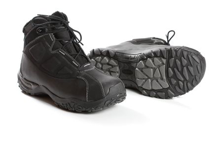 Two black winter boots , isolated on whiteの写真素材