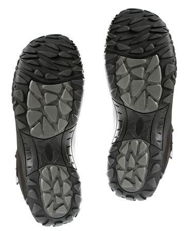 Footprint of two black winter boots, isolated on whiteの写真素材