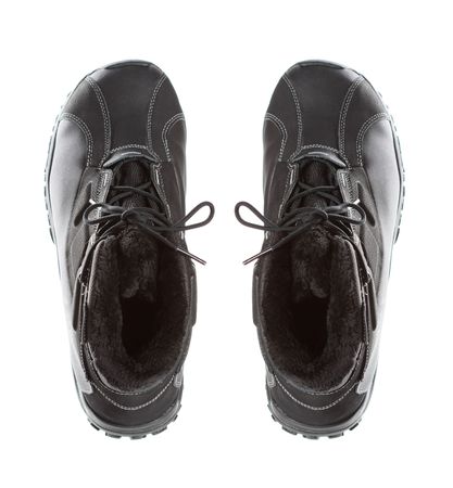 Two black men's winter boots , isolated on whiteの写真素材