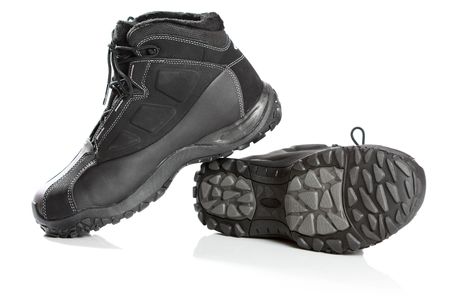 Two black winter boots , isolated on whiteの写真素材