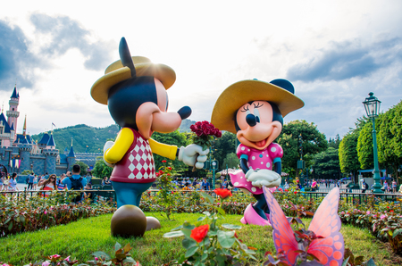 HONG KONG DISNEYLAND - MAY 2015: Mickey and minnie in love at the park in front of the castleのeditorial素材