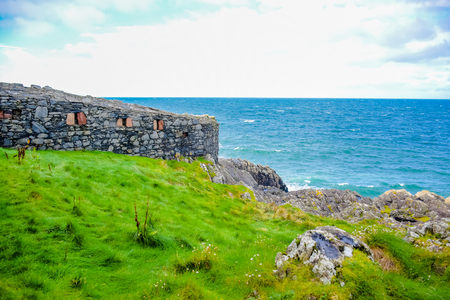 Beautiful coast of the Isle of Man from Peel Hill with great wall of Peel Castle in Peel, Isle of Manのeditorial素材