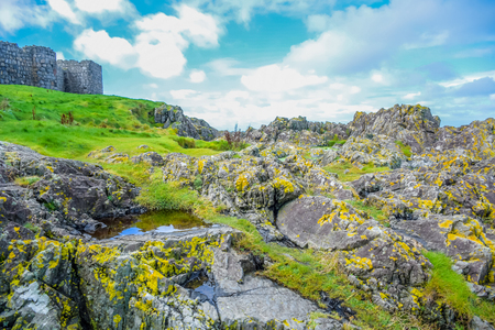 Beautiful coast of the Isle of Man from Peel Hill with great wall of Peel Castle in Peel, Isle of Manのeditorial素材