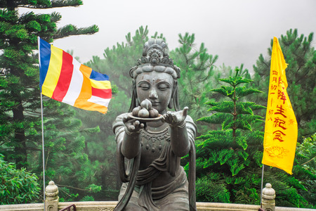 HONG KONG: Buddhist statues praising the Tian Tan Buddha at Ngong Ping, Lantau Island, in Hong Kongのeditorial素材
