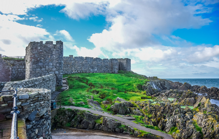 Beautiful coast of the Isle of Man from Peel Hill with great wall of Peel Castle in Peel, Isle of Manのeditorial素材