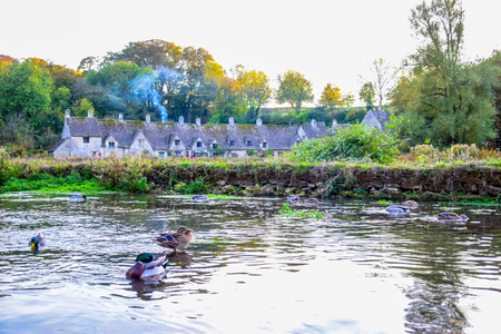 Beautiful old village of Bibury in Cotswold district in Gloucestershire, England, United Kingdomの写真素材