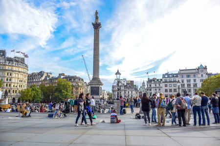 Locals and tourists visiting and hanging out at a very busy Trafalgar Square in the City of Westminster, Central London, England, United Kingdomのeditorial素材