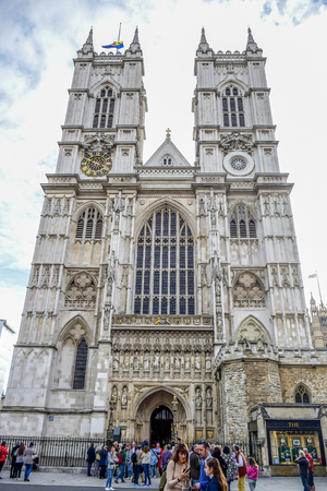Tourists entering and visiting Westminster Abbey, a gothic abbey church at the west of the Palace of Westminster in London, England, United Kingdomのeditorial素材