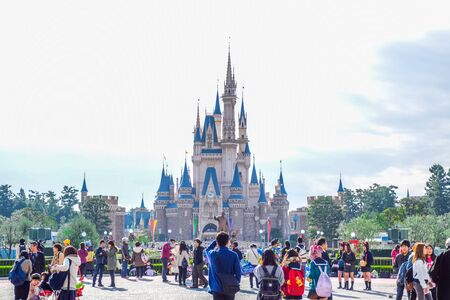 Tourists at the front of beautiful Cinderella Castle, the icon of Tokyo Disneyland in Tokyo Disney Resort in Urayasu, Chiba prefecture, Tokyo, Japanのeditorial素材