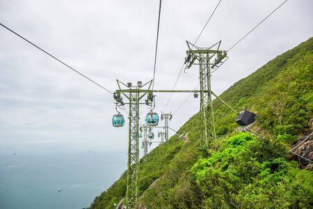 Tourists taking cable cars back and forth between The Waterfront and The Summit in Hong Kong Ocean Park, a very famous tourist destination in Hong Kongのeditorial素材
