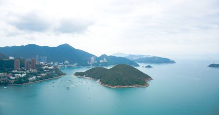 Hong Kong island landscape from aerial view in a cloudy dayの写真素材