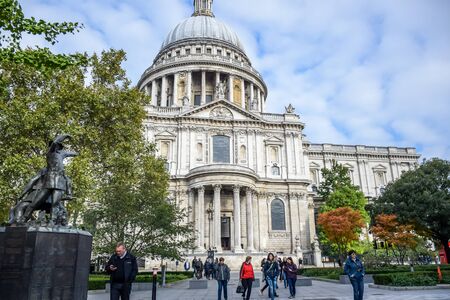 Locals and tourists spending their time at St Paul's Cathedral facade in London, England, United Kingdomのeditorial素材