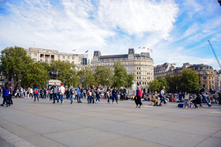 Locals and tourists gathering and hanging out at Trafalgar Square in the City of Westminster, Central London, England, United Kingdomのeditorial素材