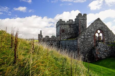 The remains of Peel castle on top of the hill constructed by Vikings in Peel city in the Isle of Manのeditorial素材