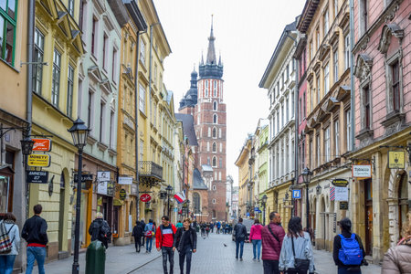 Tourists and Polish people walking through Florianska street, the main streets in Krakow Old Town and one of the most famous streets of Krakow, Polandのeditorial素材
