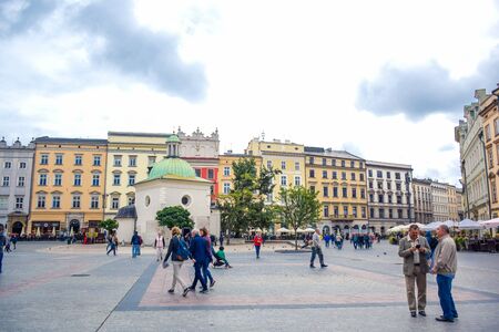 Tourists enjoying their time at Krakow's Main Square (Rynek Glowny) located at center of the Old Town district in Lesser, Polandのeditorial素材