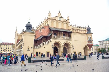 Tourists enjoying their time at Krakow's Cloth Hall located at the center of main market square (Main Square) in the Krakow Old Town, Polandのeditorial素材
