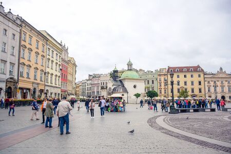 Tourists enjoying their time at Krakow's Main Square (Rynek Glowny) located at center of the Old Town district in Lesser, Polandのeditorial素材