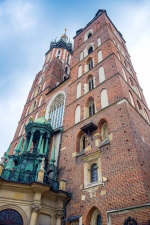 St. Mary's Basilica, an ancient brick Gothic Polish church adjacent to Main Town Square in Krakow, the most famous tourist destination in Polandのeditorial素材