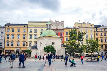Tourists enjoying their time at Krakow's Main Square (Rynek Glowny) located at center of the Old Town district in Lesser, Polandのeditorial素材