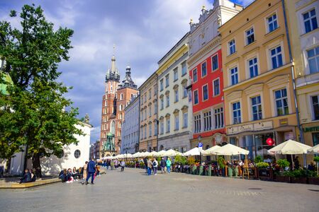 Tourists enjoying their time at Krakow's Main Square (Rynek Glowny) located at center of the Old Town district in Lesser, Polandのeditorial素材