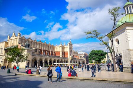 Tourists enjoying their time at Krakow's Cloth Hall located at the center of main market square (Main Square) in the Krakow Old Town, Polandのeditorial素材