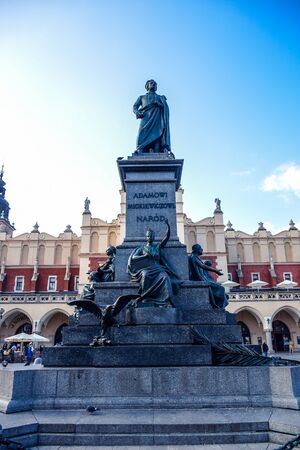 The statue of Adam Mickiewicz, the greatest Polish Romantic poet of the 19th century locted at Rynek Glowny Main Square of Krakow Old Town, Polandのeditorial素材