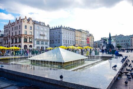 Square fountain at Main Square of Krakow Old Town district, a famous tourist destination in Krakow, Polandのeditorial素材