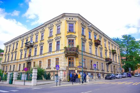 Tourists and Polish locals walking and strolling on the street in the city of Krakow, Polandのeditorial素材