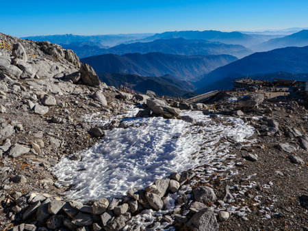Mountain landscape with snow-capped peaks and clear blue skyの写真素材