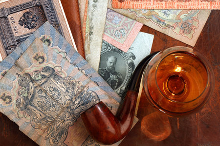 Russian money of the early twentieth century, a Smoking pipe and a glass of cognac