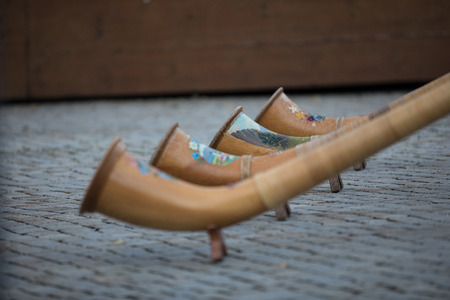 Four alpine horns during a folklore festivalの写真素材