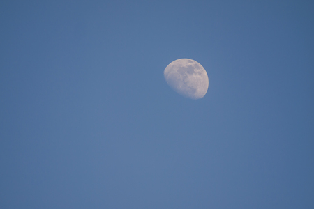 bright moon in evening time on beautiful natural blue sky backgroundの写真素材