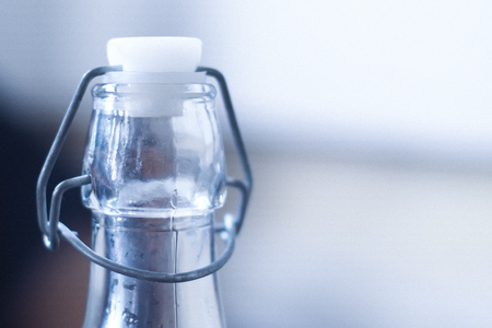 Empty transparent bottle on the selective blur background.の写真素材