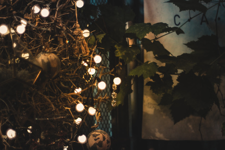 Christmas holiday party celebration decoration with leaf and bulb lighting abstract background, Christmas event.の写真素材