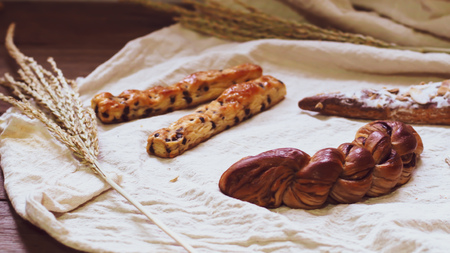 Breads and toast for breakfast on white bed sheet background, Healthy breakfast. Morning health lifestyle concept idea backgroundの写真素材