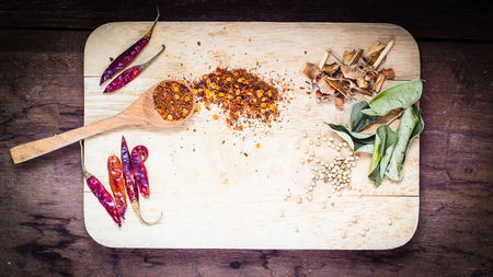 Wooden spoon with different types of quinoa Thai food ingredient and space for text on wooden table background, top viewの写真素材