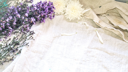 Vintage style decorate with white flowers. Idea background. Eco design with vintage elements linen fabric. Copy spaceの写真素材