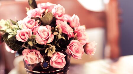 Bouquet vintage group of pink roses on wooden table, soft focusの写真素材