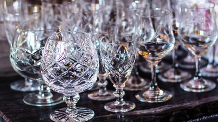 Close up picture of empty crystal wine glasses in restaurantの写真素材
