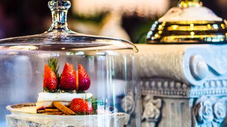 Slice of strawberry cheesecake bakery shop background. Selective focusの写真素材
