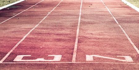 Starting line on running track .Red running track Synthetic rubber on the athletic stadiumの写真素材