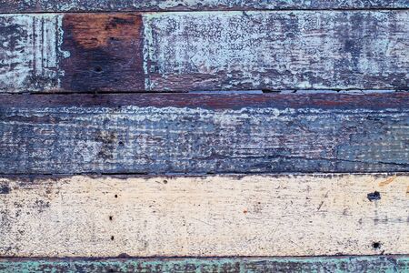 Vintage wood background with peeling paint. Vintage beach wood background - Old weathered wooden plank paintedの写真素材
