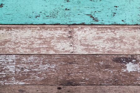 Vintage wood background with peeling paint. Vintage beach wood background - Old weathered wooden plank paintedの写真素材