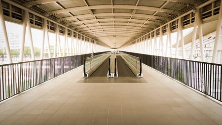 Corridor and stairs. The iron bridge over street at the sunrise. Structure designの写真素材