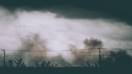 toxic air pollution spread all over the agriculture field. clean air concept idea. environment save earth idea backgroundの写真素材